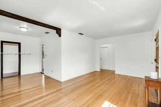 6851 SW 32nd Street, Miami, FL 33155 Wood-finish flooring, decorative corbel beam detailing, and a solid wood entry door with stained glass inlay