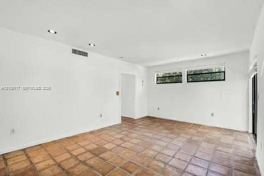 6851 SW 32nd Street, Miami, FL 33155 Interior space featuring terracotta-style tile flooring, recessed lighting, and horizontal windows