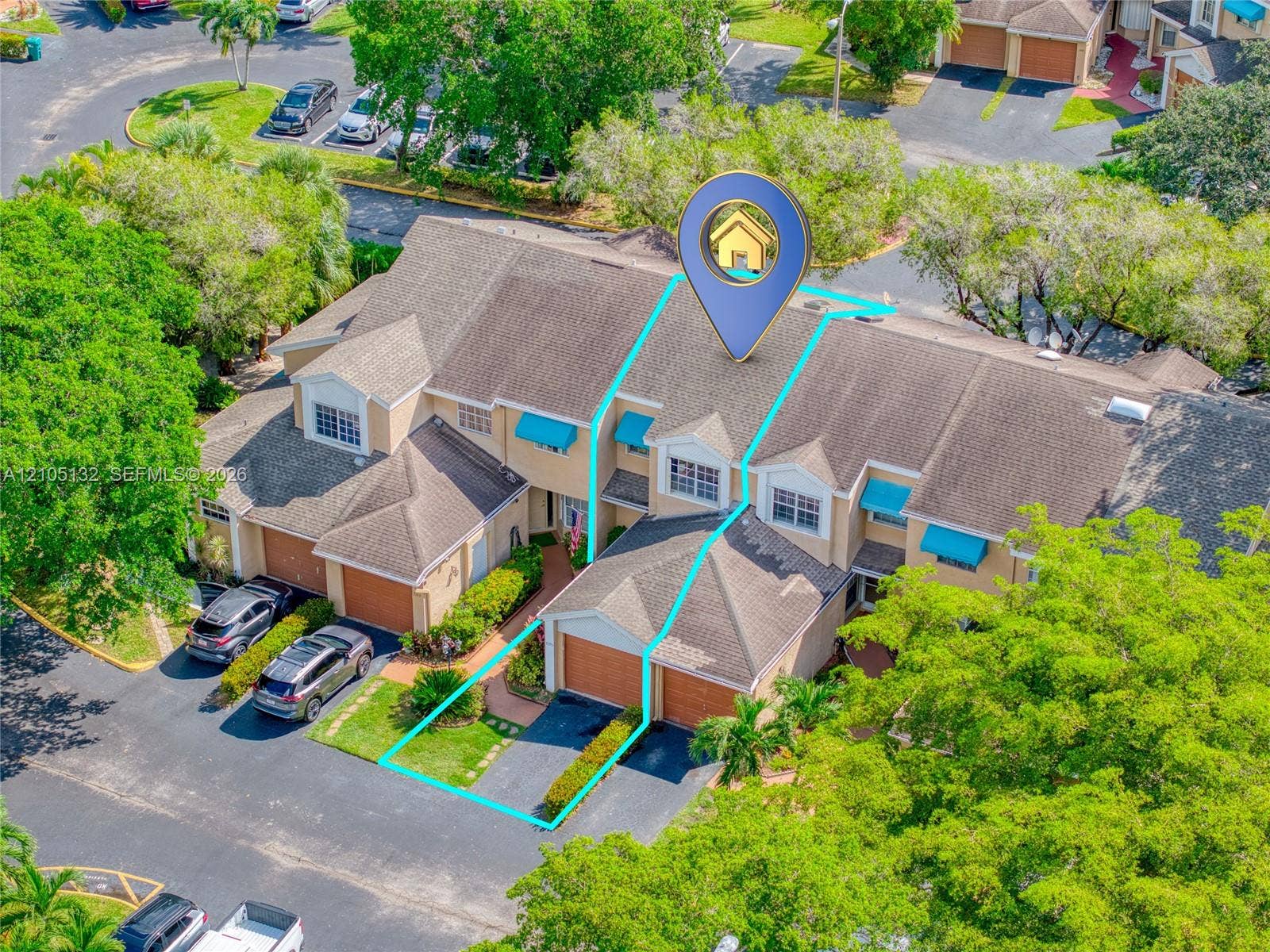 Attached garage with a paved driveway