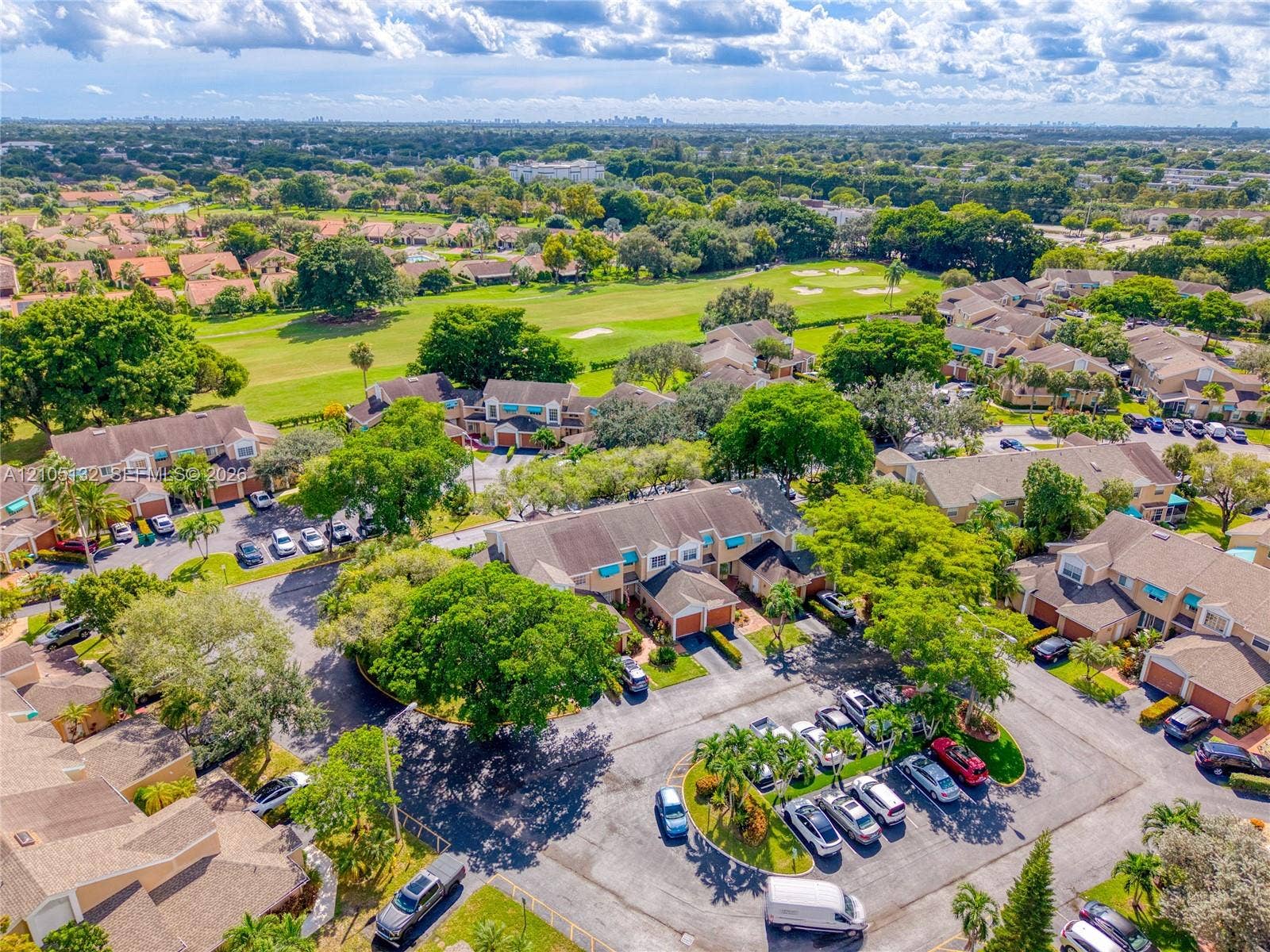 Townhome community with tile roofs and an integrated golf course