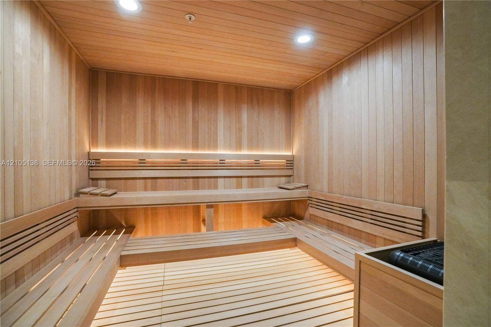 2411 Laguna Circle, #1505, North Miami, FL 33181 Custom sauna featuring wood paneling, built-in multi-level wood benches, slat wood flooring, and integrated lighting
