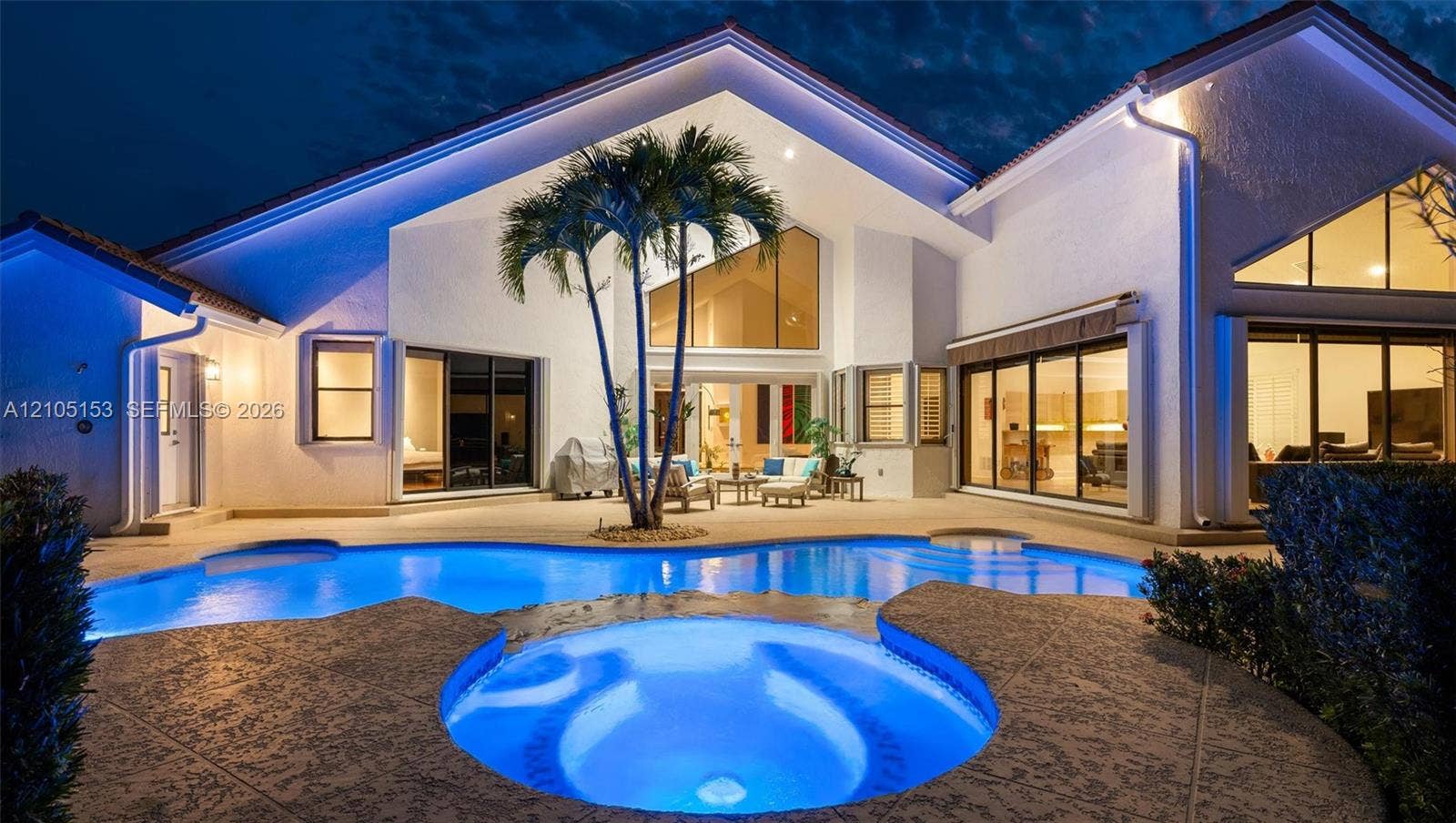 Expansive backyard with a freeform pool and integrated spa