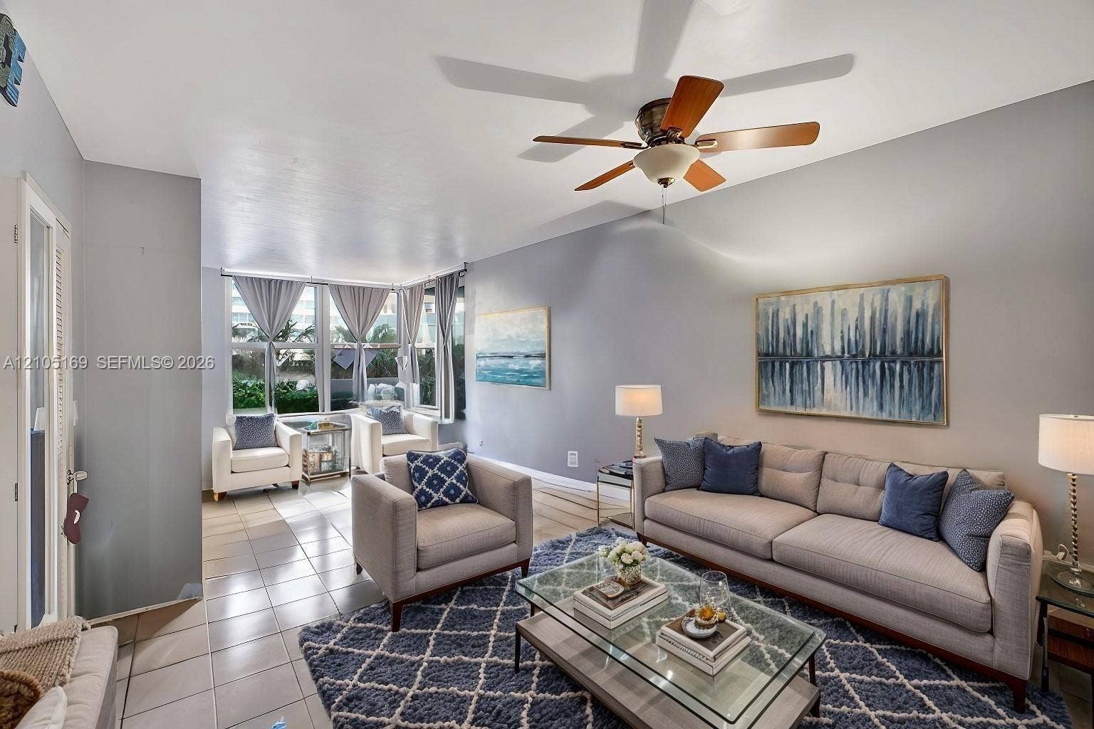 2899 Collins Avenue, #521, Miami Beach, FL 33140 Recessed lighting, wood-finish ceiling fan, tiled flooring, and multiple windows