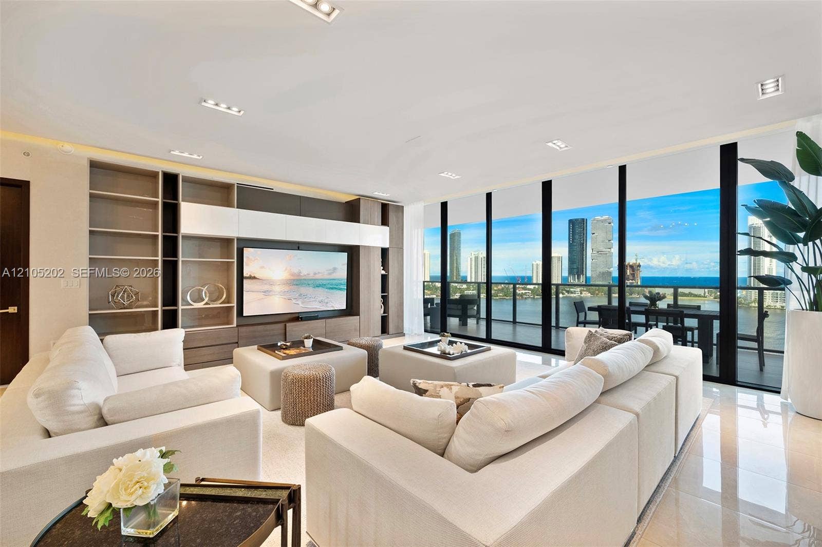 Floor-to-ceiling windows, built-in custom cabinetry, recessed lighting, and large-format tile flooring