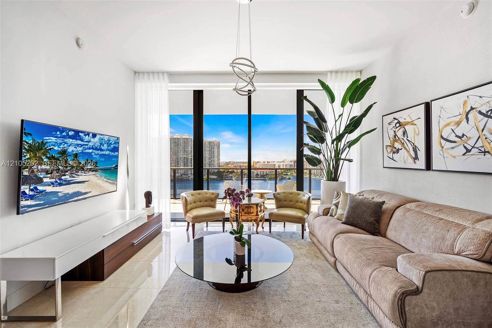 Floor-to-ceiling windows, polished tile flooring, custom built-in cabinetry, and a contemporary architectural pendant light fixture