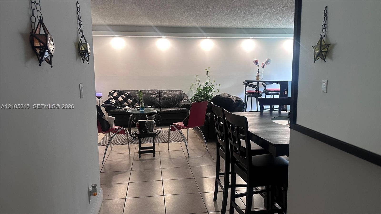 17021 N Bay Road, #114, Sunny Isles Beach, Sunny Isles Beach, FL 33160 Ceramic tile flooring, recessed ceiling lighting, and decorative geometric wall-mounted light fixtures