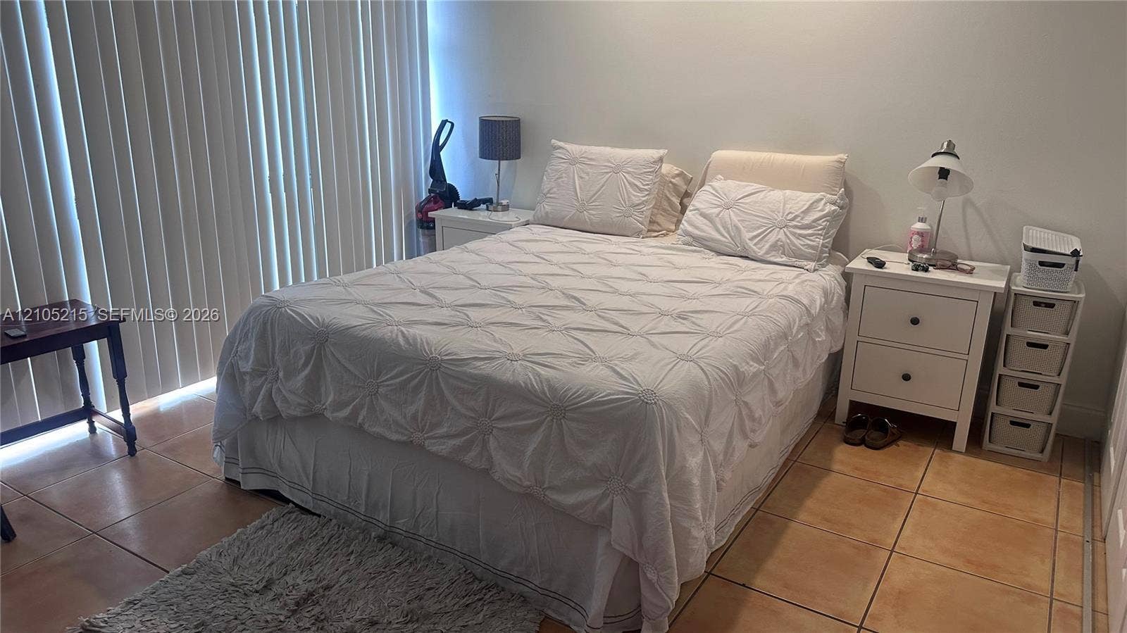 17021 N Bay Road, #114, Sunny Isles Beach, Sunny Isles Beach, FL 33160 Room featuring large-format ceramic floor tile and vertical blinds covering the window wall