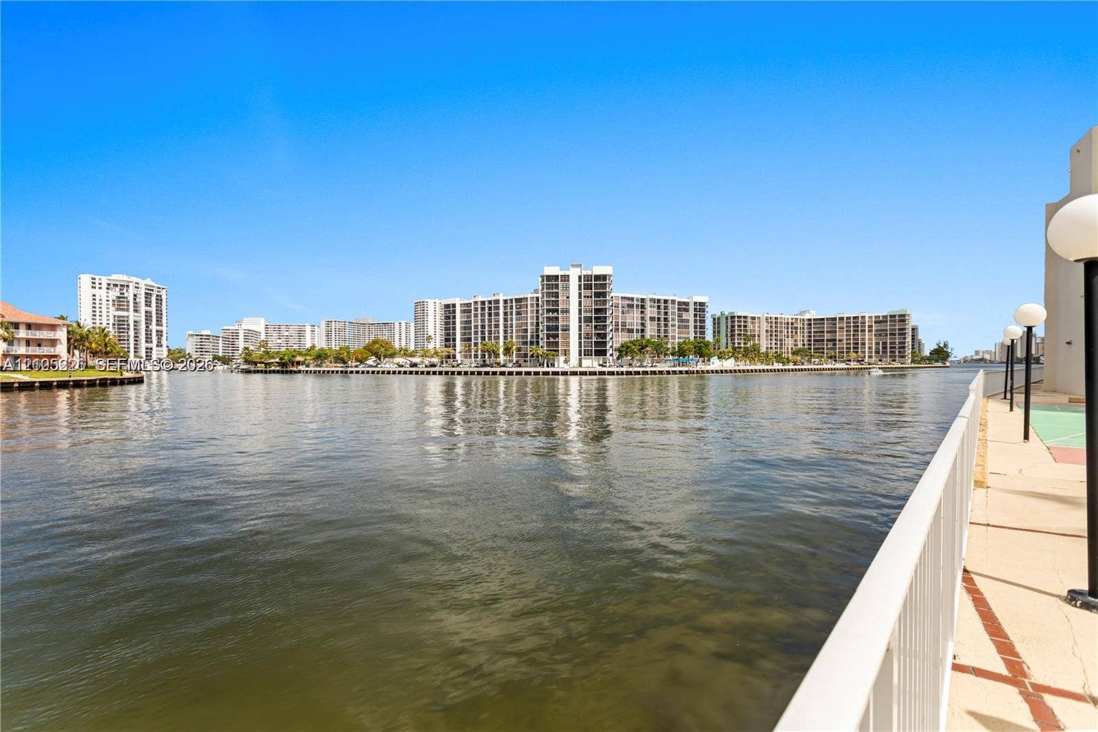 3800 S Ocean Drive, #801, Hollywood, Hollywood, FL 33019 Waterfront patio featuring a paved surface, built-in outdoor grill, painted sports court, and metal railing enclosure