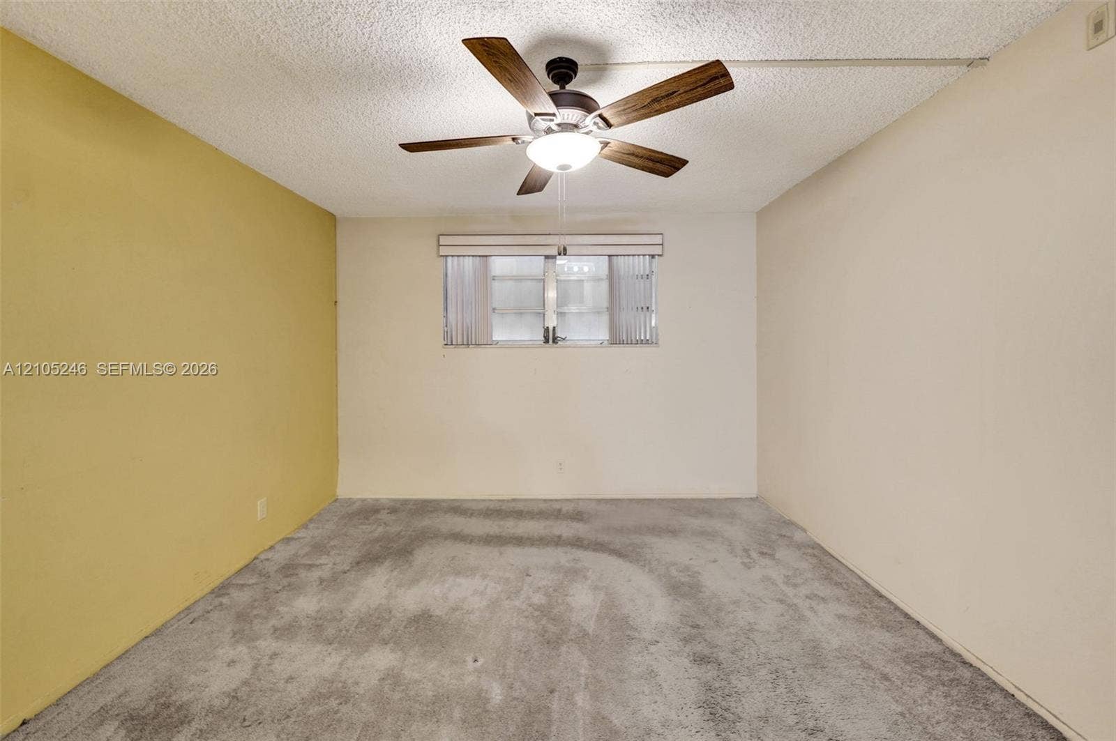 1400 Tallwood Avenue, #207, Hollywood, FL 33021 Room featuring carpeting, a ceiling fan with integrated lighting, and a window with horizontal blinds