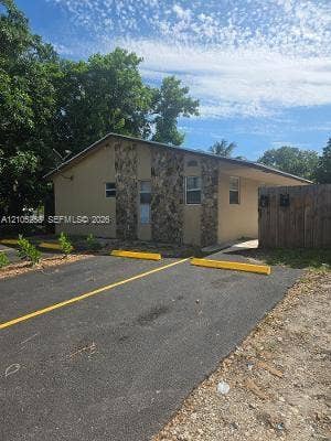 2208 Garfield Street, #B, Hollywood, Hollywood, FL 33020 Asphalt parking area with yellow striping and parking blocks