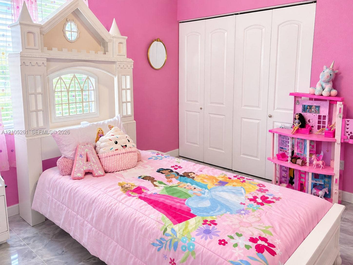 Recessed window, wood-finish flooring, and white bi-fold closet doors