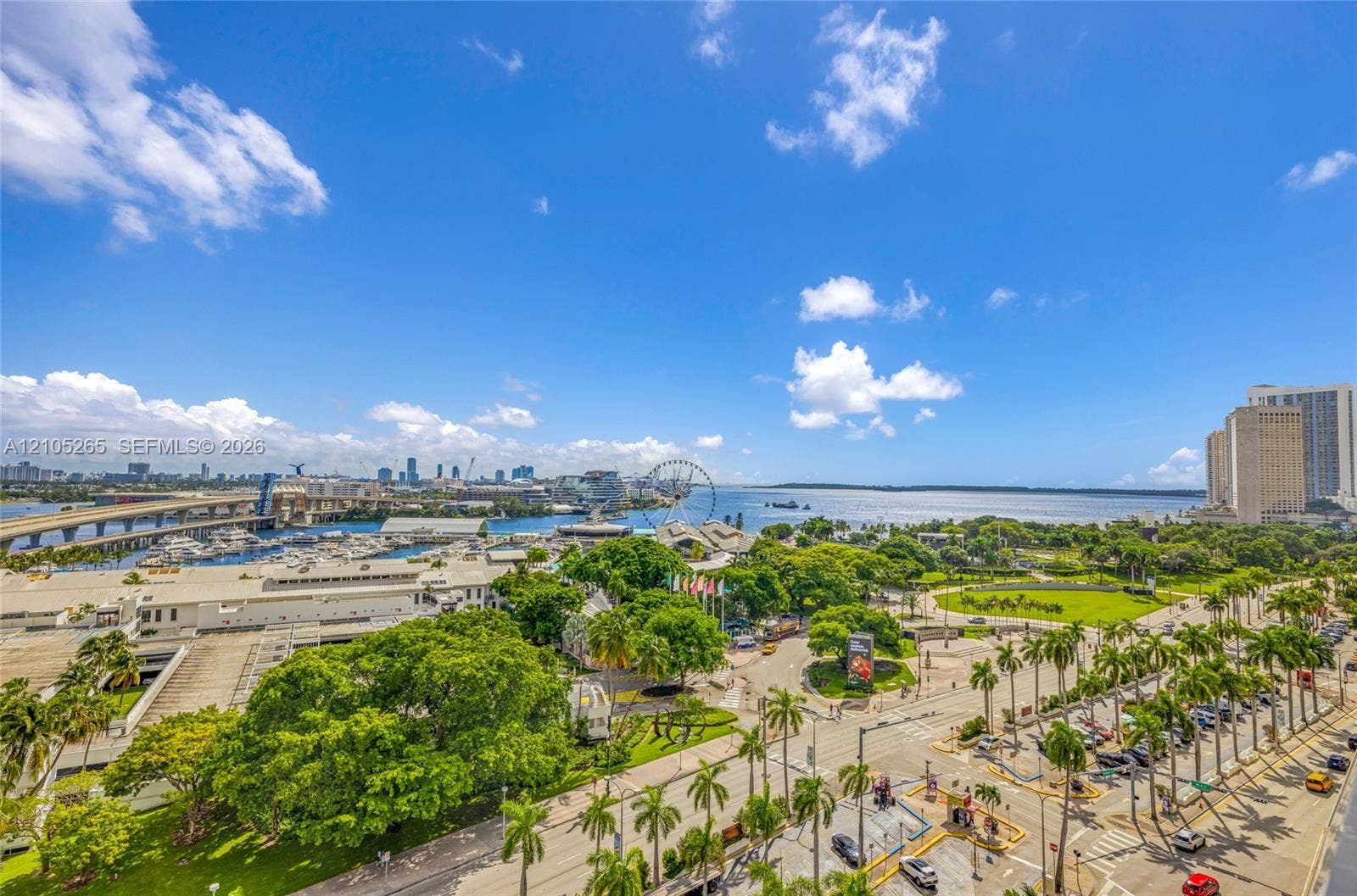 398 NE 5th Street, #2219, Miami, FL 33132 Elevated perspective featuring coastal waters, a marina, and palm-lined urban landscaping