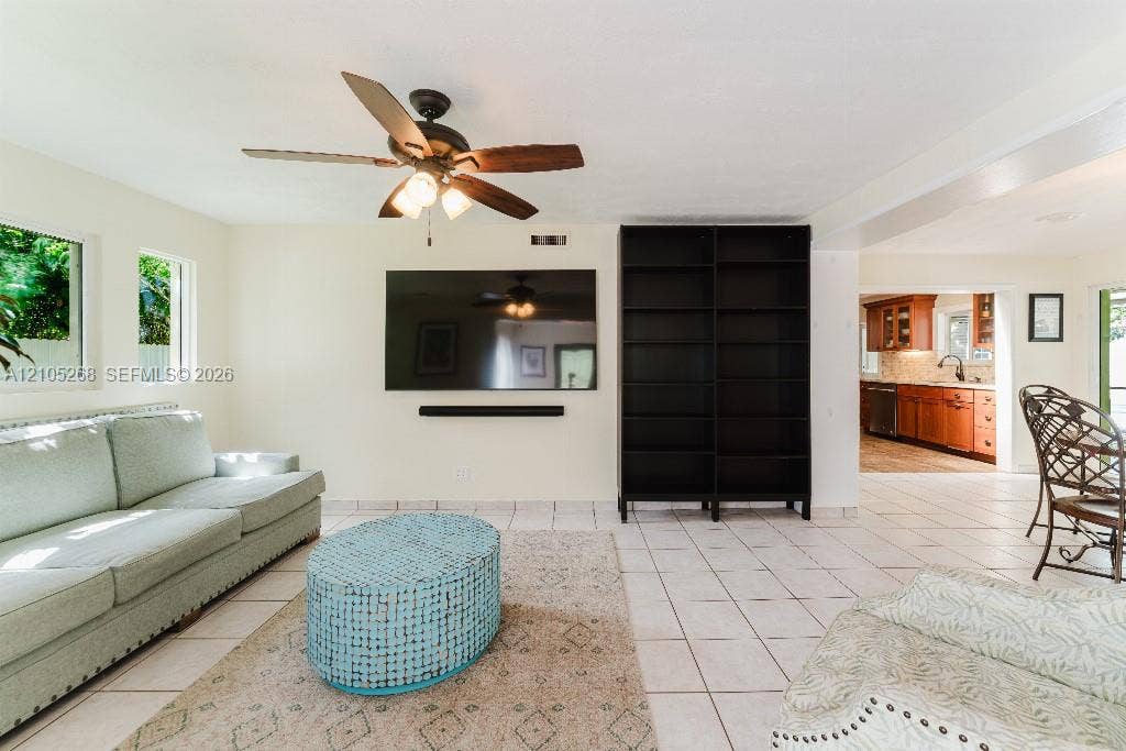 230 Miami Springs Avenue, Miami Springs, FL 33166 Recessed lighting, ceiling fan with integrated light fixture, mounted television, built-in shelving, and tile flooring