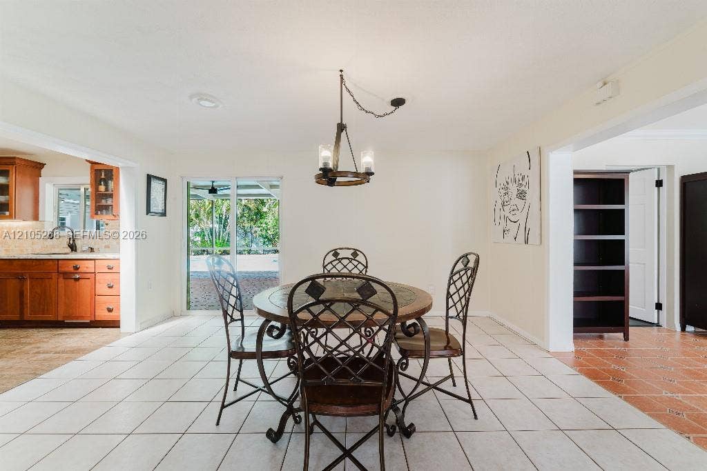 230 Miami Springs Avenue, Miami Springs, FL 33166 White tile flooring with a neutral wall color throughout