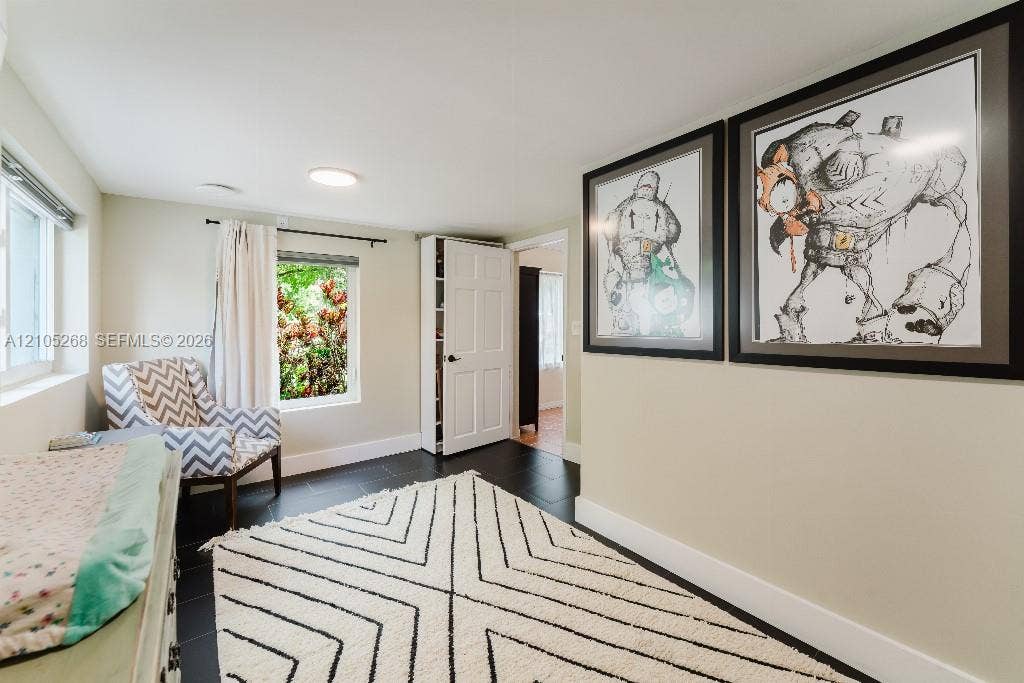 230 Miami Springs Avenue, Miami Springs, FL 33166 Recessed ceiling lighting, dark wood-finish flooring, and white interior doors