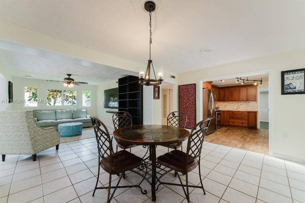 230 Miami Springs Avenue, Miami Springs, FL 33166 Tile flooring throughout, recessed lighting, and a built-in shelving unit