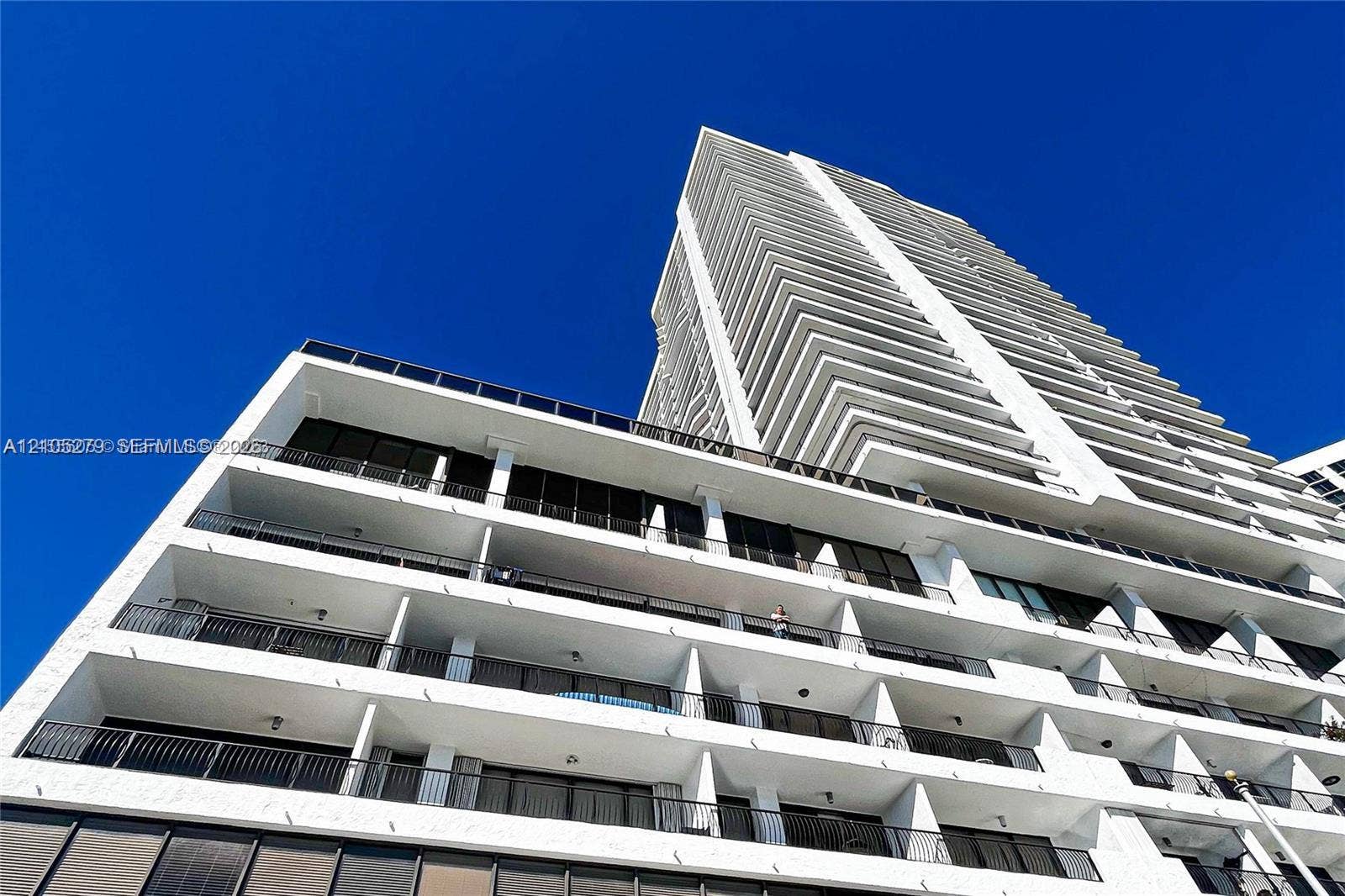 High-rise building with a white stucco facade