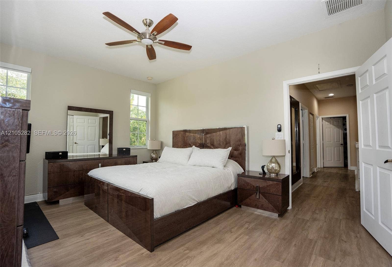 1104 SW 146th Terrace, Pembroke Pines, FL 33027 Vaulted ceilings, wood-finish flooring, multi-pane windows, and a ceiling fan with integrated lighting