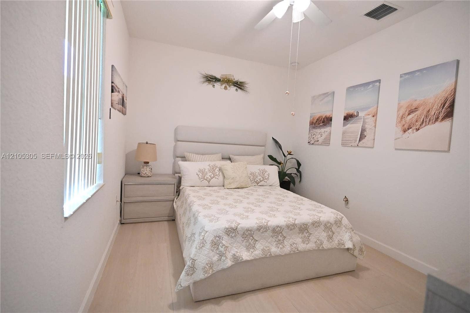 White interior walls complemented by wood-finish flooring