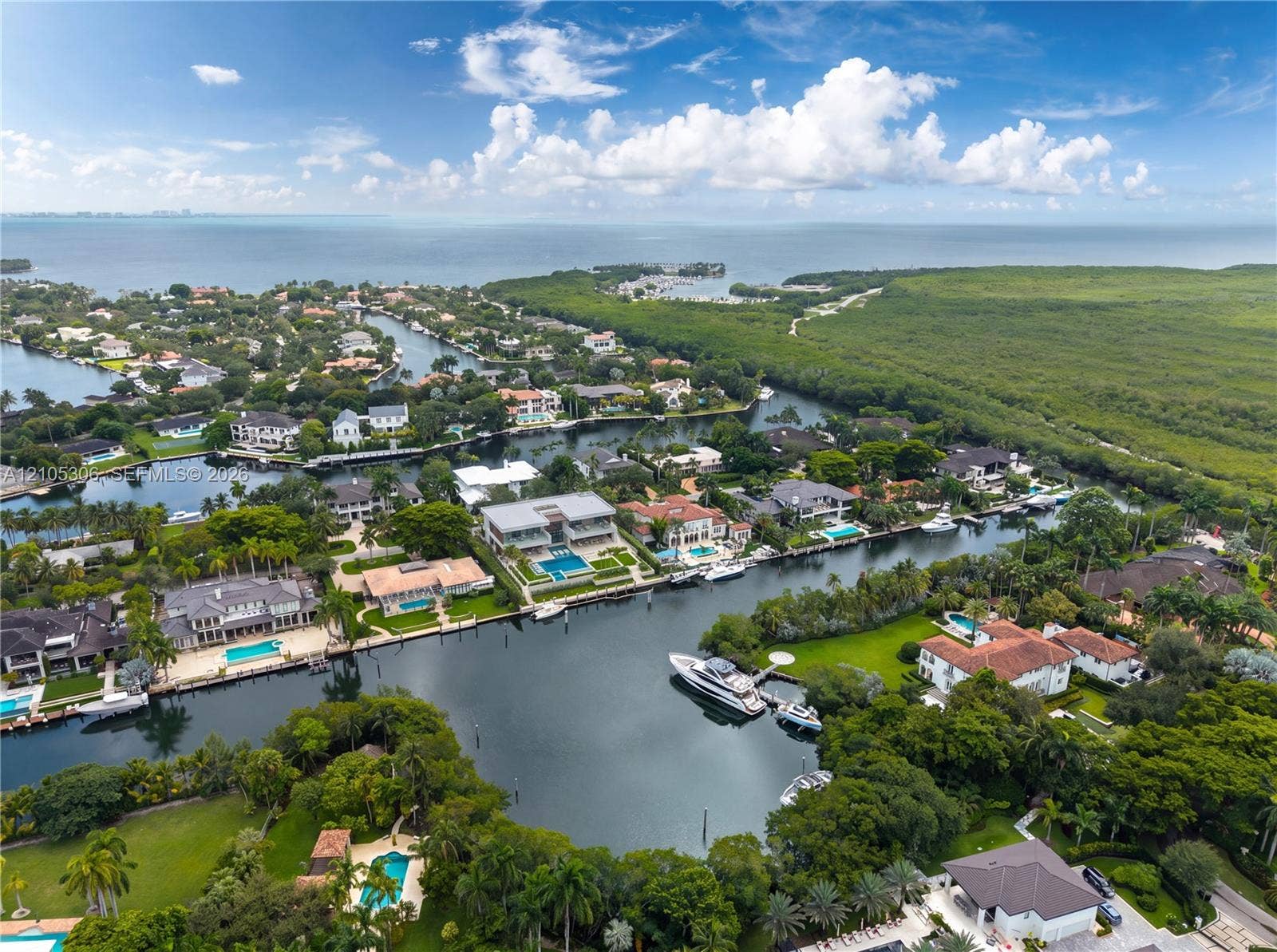 The property can accommodate an approximately 100-foot yacht, while the wide bay beyond provides the maneuvering room a vessel of this scale requires.
