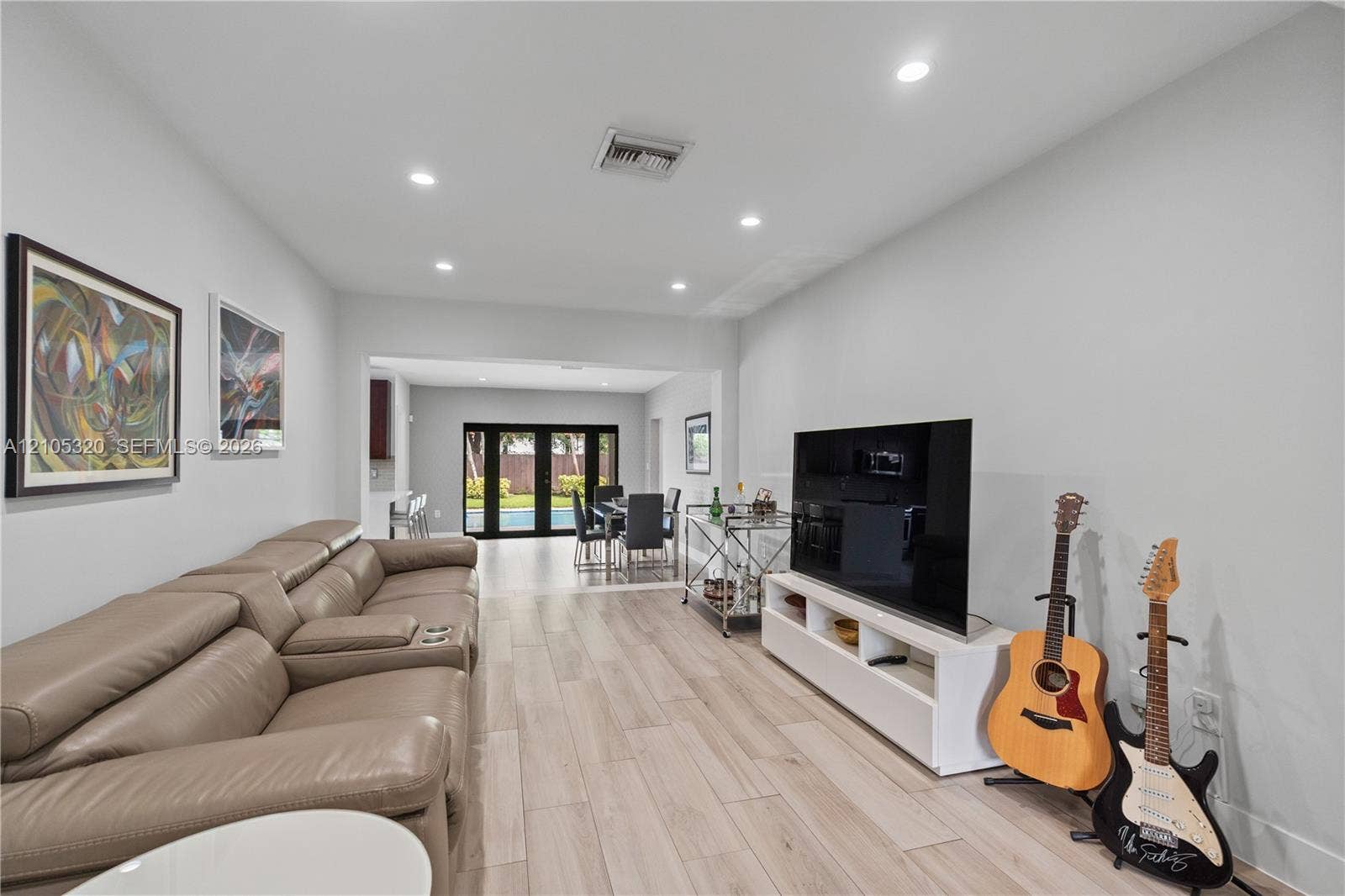 Spacious interior with wood-finish flooring and recessed lighting