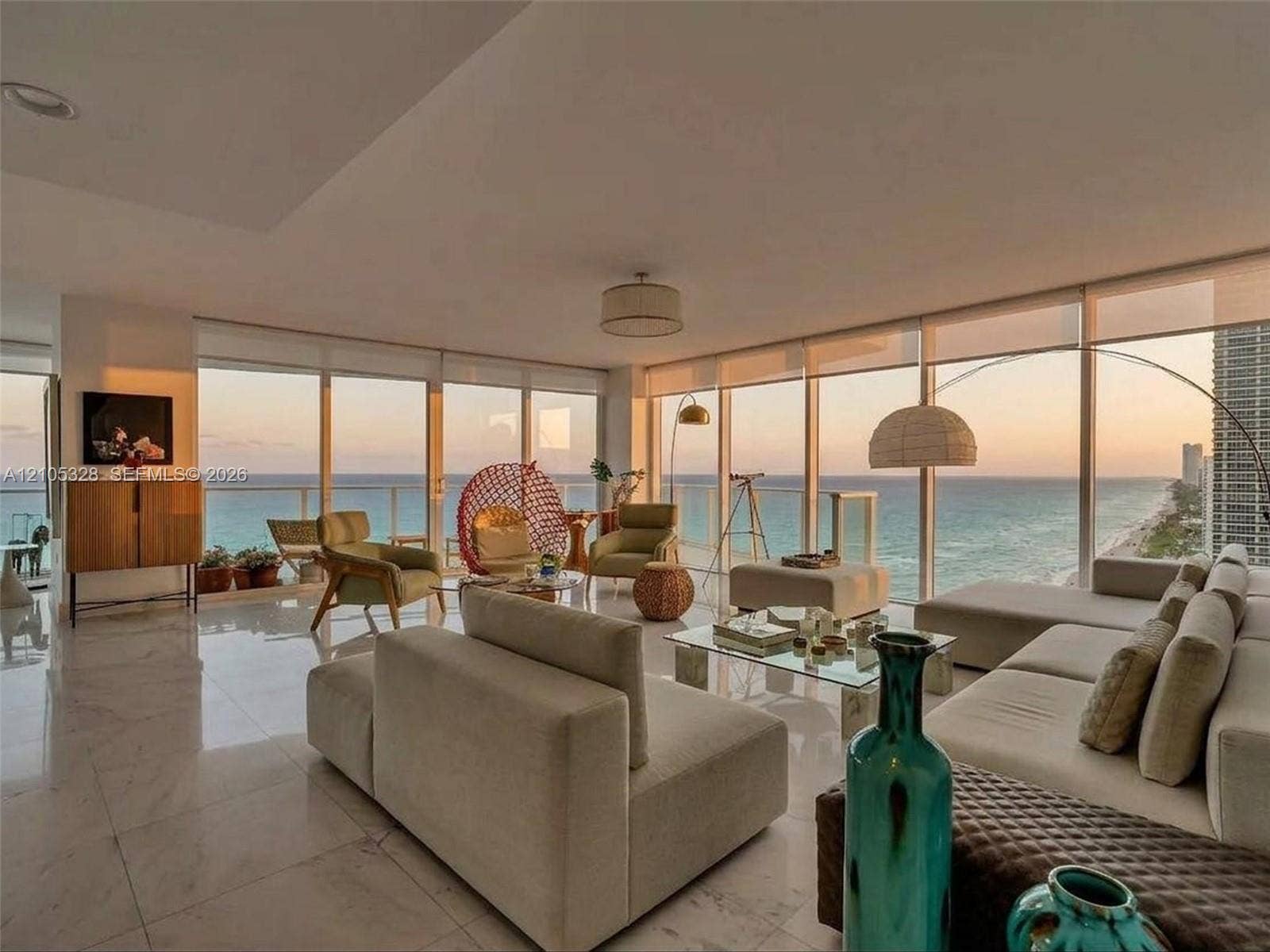 3951 S Ocean Drive, #1901, Hollywood, FL 33019 Expansive living area featuring floor-to-ceiling windows, panoramic ocean views, polished marble flooring, and recessed ceiling lighting.