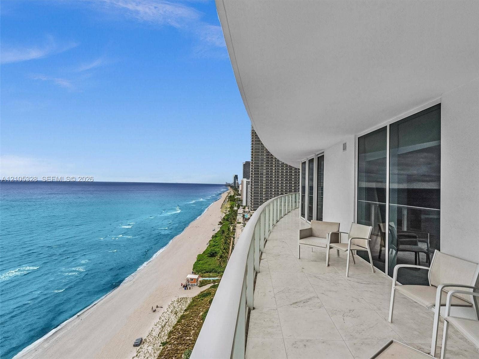 3951 S Ocean Drive, #1901, Hollywood, FL 33019 Expansive private balcony featuring glass railings and breathtaking, unobstructed panoramic ocean views.
