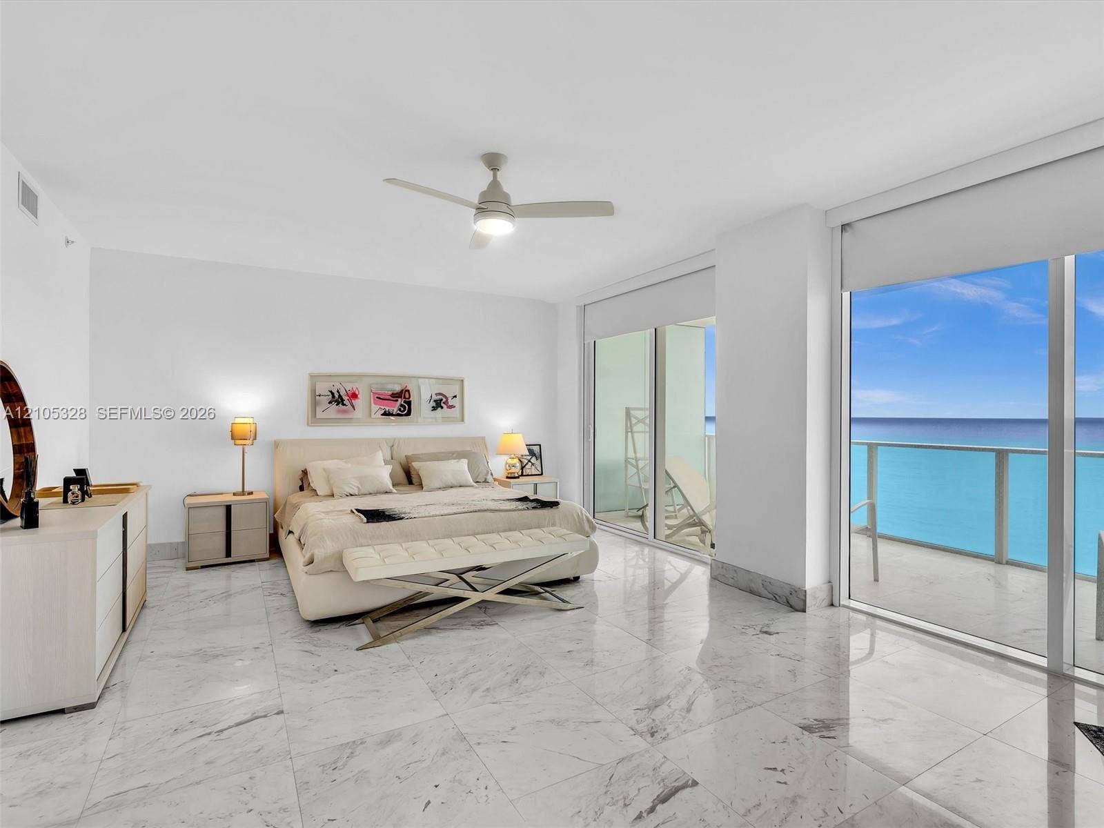 3951 S Ocean Drive, #1901, Hollywood, FL 33019 Sliding glass doors opening to a balcony, ceiling fan, white tile flooring, white walls, and a recessed ceiling