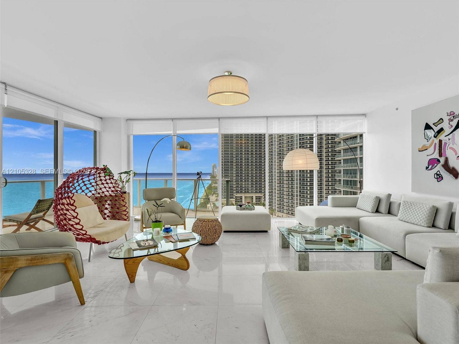3951 S Ocean Drive, #1901, Hollywood, FL 33019 Spacious open-concept living area featuring Carrara marble flooring and recessed ceiling lighting.