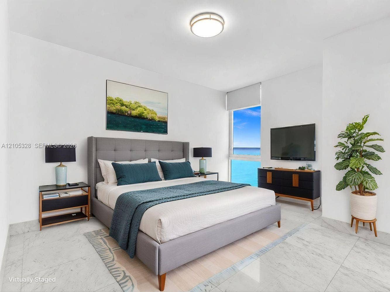 3951 S Ocean Drive, #1901, Hollywood, FL 33019 Bright and airy interior featuring soaring ceilings, dramatic floor-to-ceiling windows that fill the space with natural light, elegant hard-surface flooring, and recessed ceiling lighting.