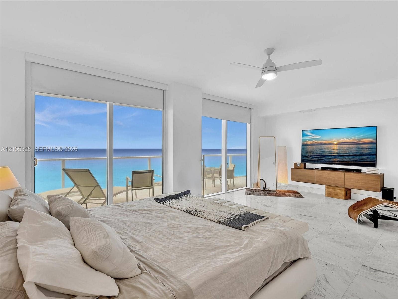 3951 S Ocean Drive, #1901, Hollywood, FL 33019 Wake up to breathtaking ocean views from the comfort of your bed in this spacious primary suite, featuring floor-to-ceiling sliding glass doors with direct access to a private balcony.