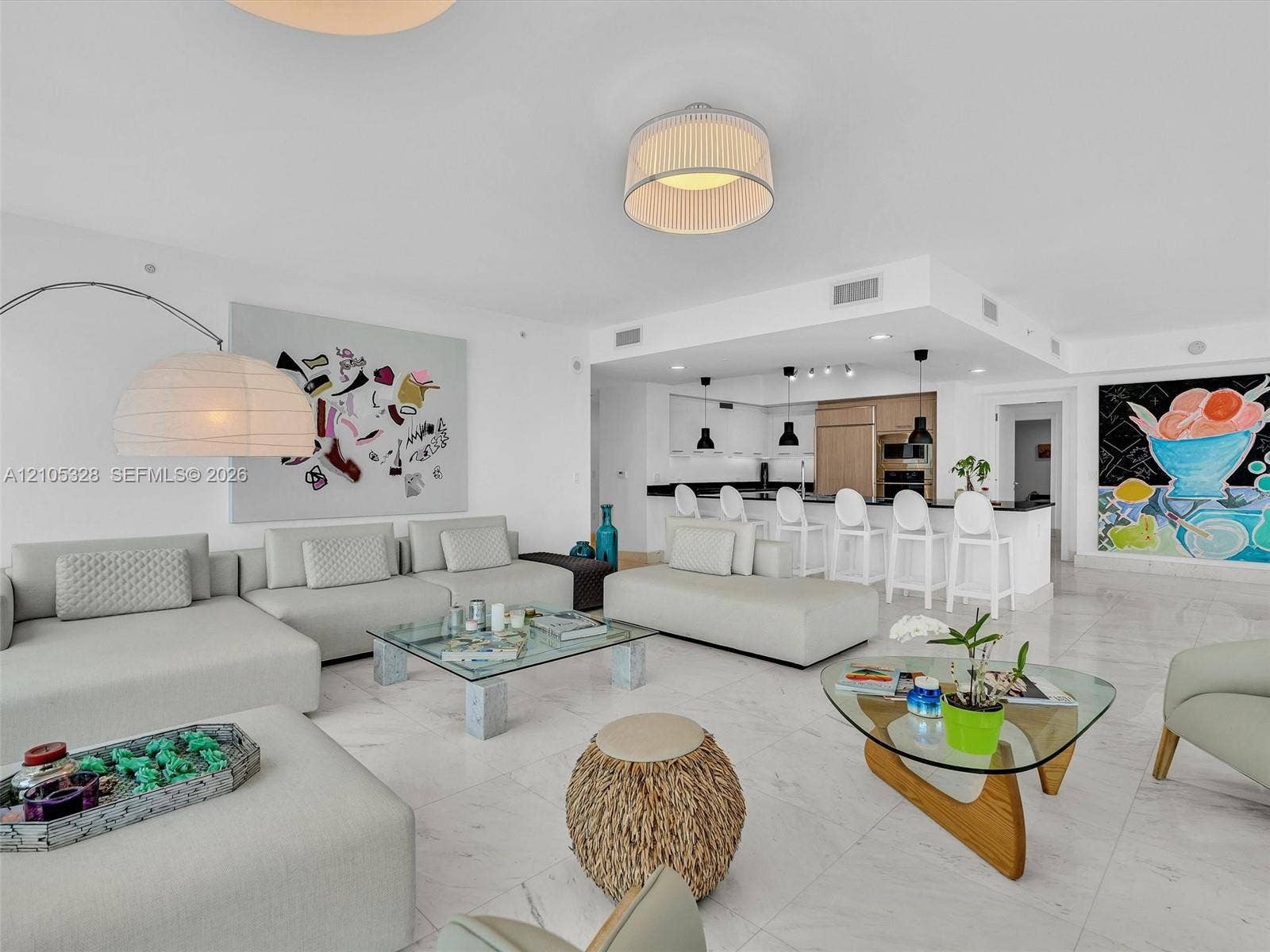3951 S Ocean Drive, #1901, Hollywood, FL 33019 Spacious open-concept living area featuring Carrara marble flooring and recessed ceiling lighting.