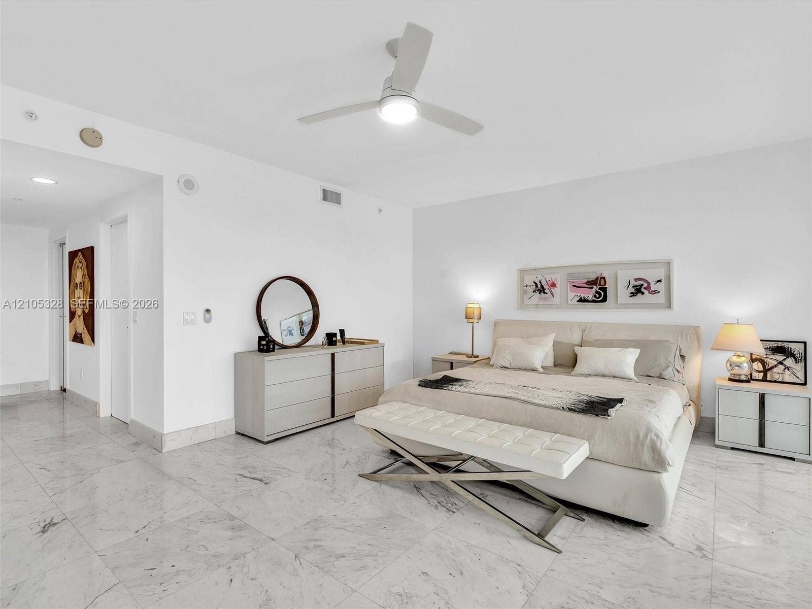 3951 S Ocean Drive, #1901, Hollywood, FL 33019 Wake up to breathtaking ocean views from the comfort of your bed in this spacious primary suite, featuring floor-to-ceiling sliding glass doors with direct access to a private balcony.