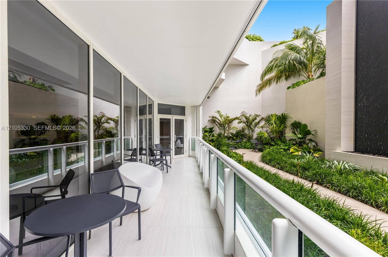 21205 Yacht Club Drive, #304, Aventura, FL 33180 Outdoor patio with wood-finish flooring and glass railing