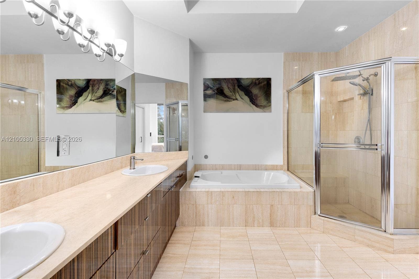 21205 Yacht Club Drive, #304, Aventura, FL 33180 Dual vanity with undermount sinks, integrated soaking tub, tiled shower enclosure, and tiled flooring