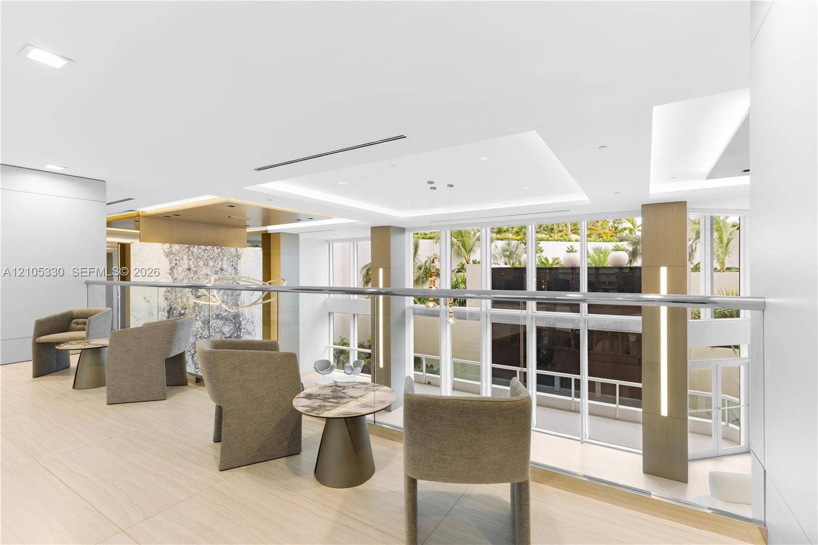21205 Yacht Club Drive, #304, Aventura, FL 33180 Upper-level lounge area with light wood-finish flooring, recessed lighting, and a glass railing system
