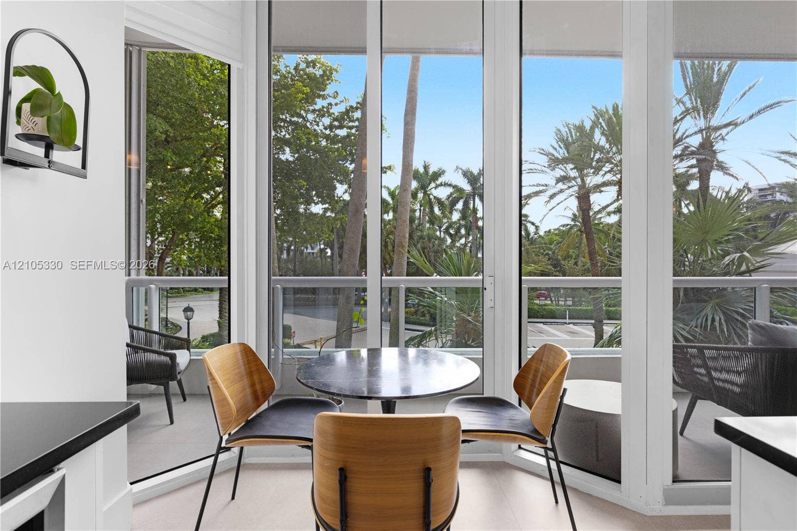 21205 Yacht Club Drive, #304, Aventura, FL 33180 Full-height glass panels, white interior walls, and a balcony with a glass railing