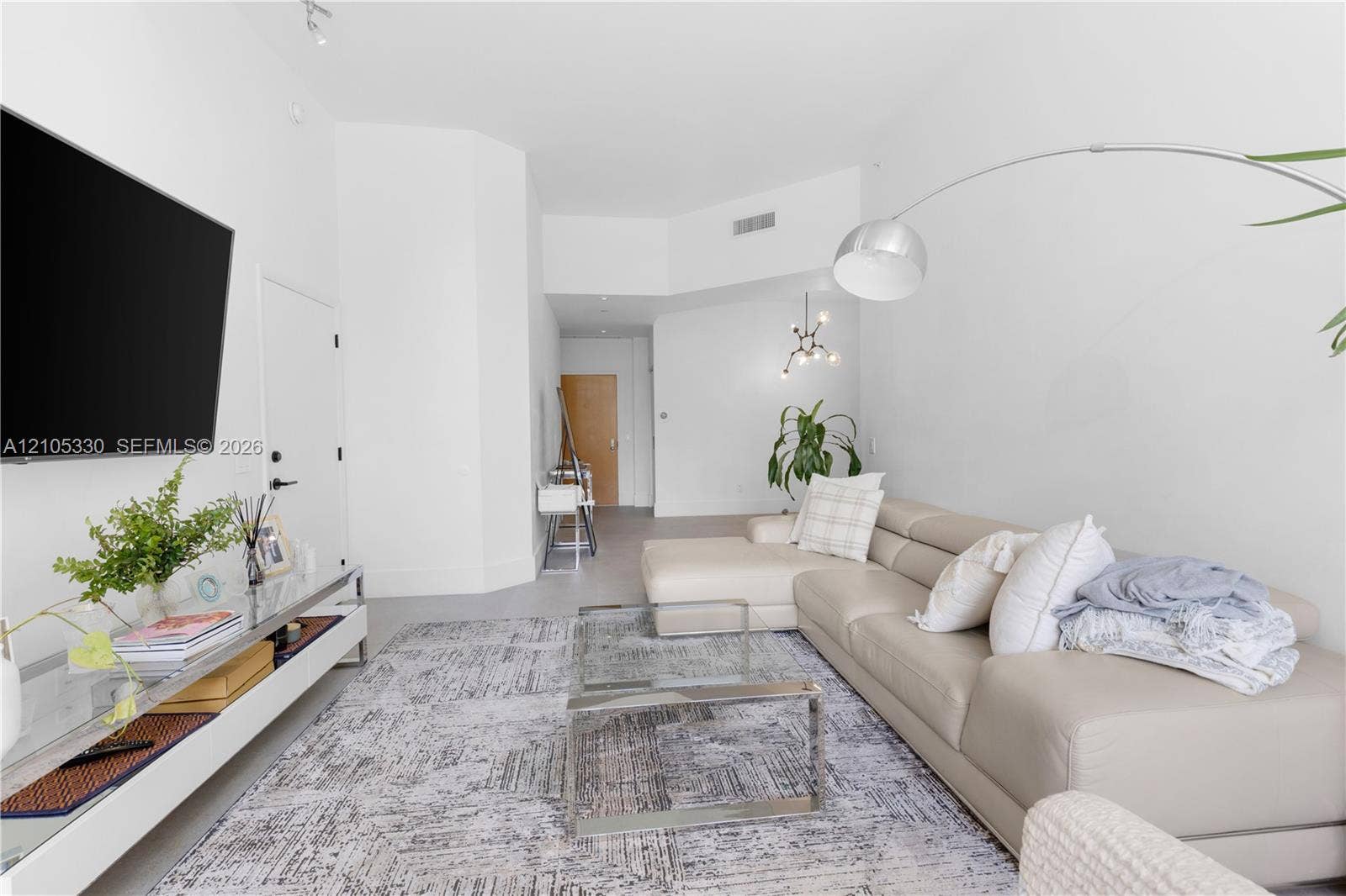 21205 Yacht Club Drive, #304, Aventura, FL 33180 Bright living area featuring high ceilings, light-toned walls, and recessed lighting