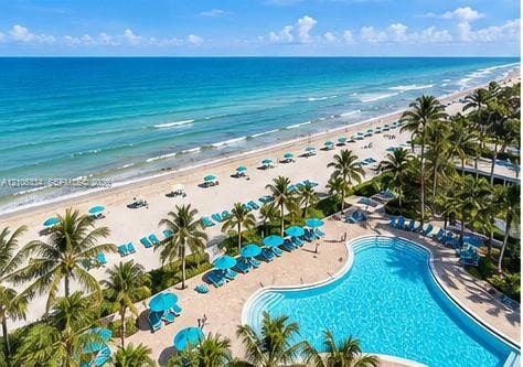 Expansive beachfront setting featuring a large swimming pool with integrated steps, a sandy beach area, and numerous mature palm trees