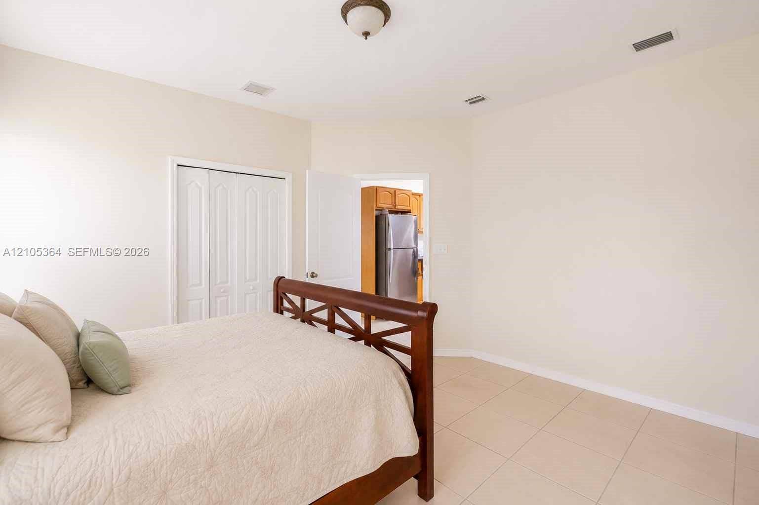 Recessed lighting, tile flooring, and a ceiling-mounted light fixture
