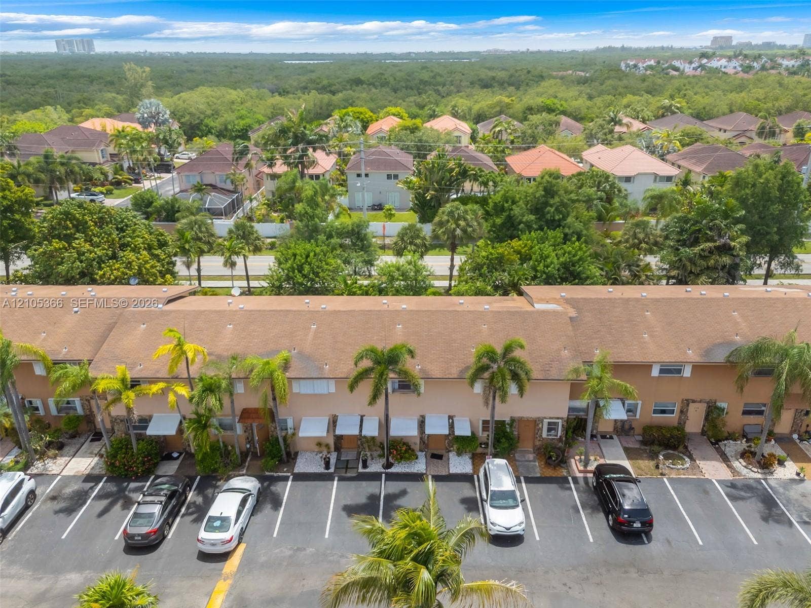 Townhome-style residences featuring individual entrances and awnings