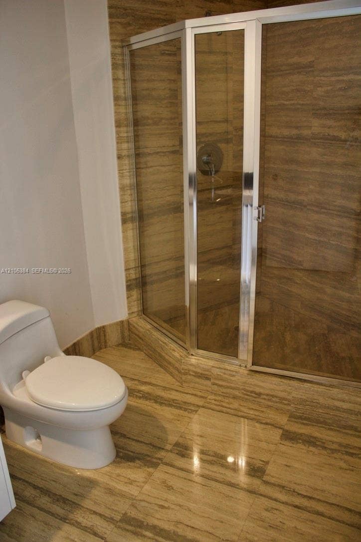 16001 Collins Avenue, #2803, Sunny Isles Beach, Sunny Isles Beach, FL 33160 Glass-enclosed shower with polished chrome fixtures
