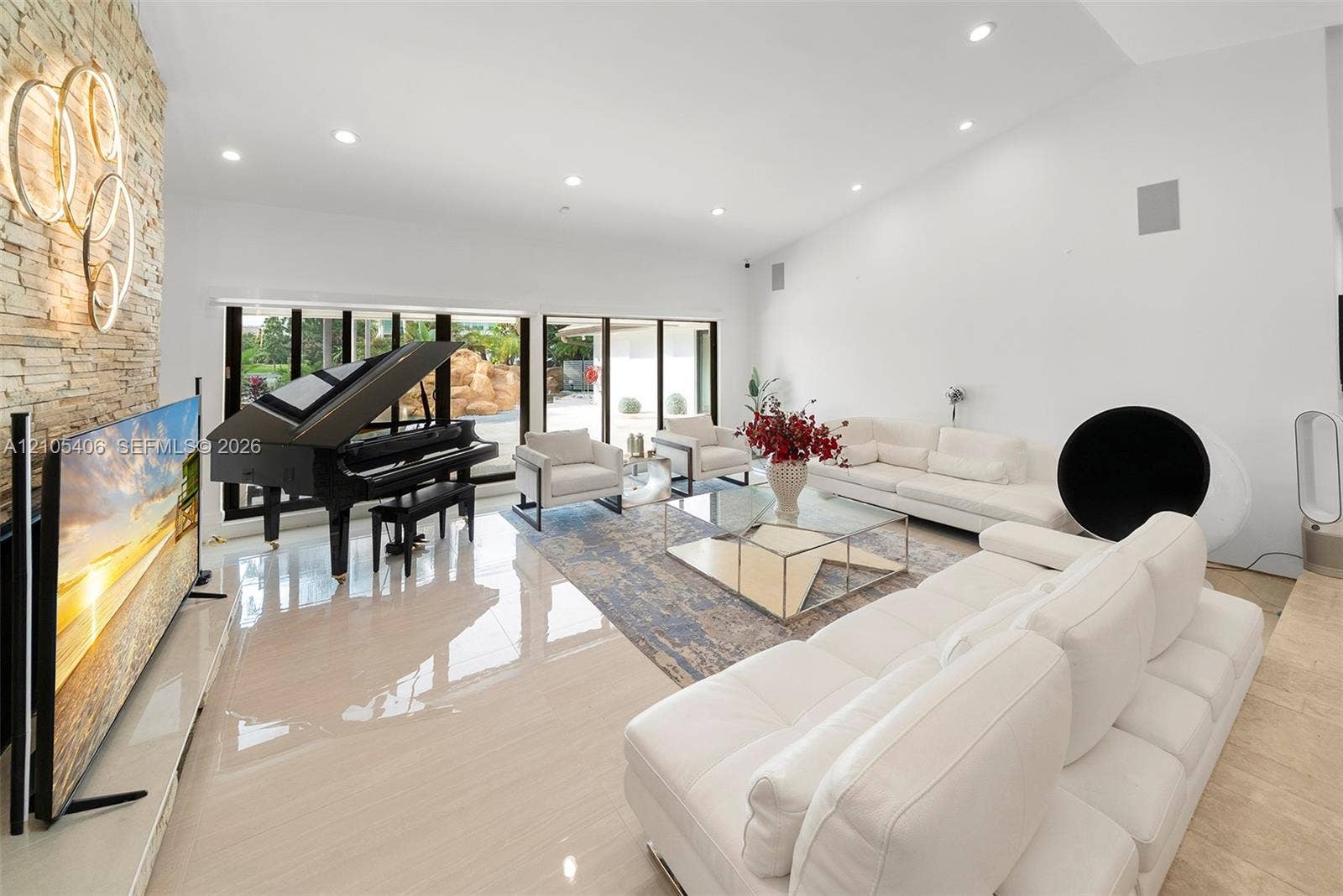 Vaulted ceilings, recessed lighting, and expansive windows