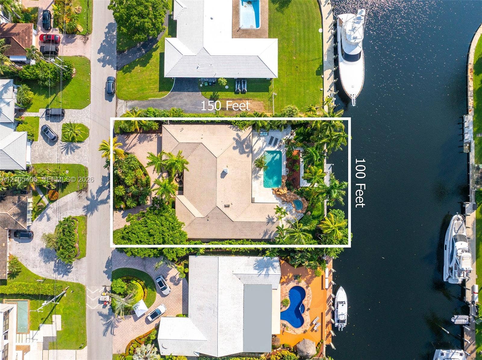 Waterfront property with private boat dockage, a swimming pool, and an integrated spa