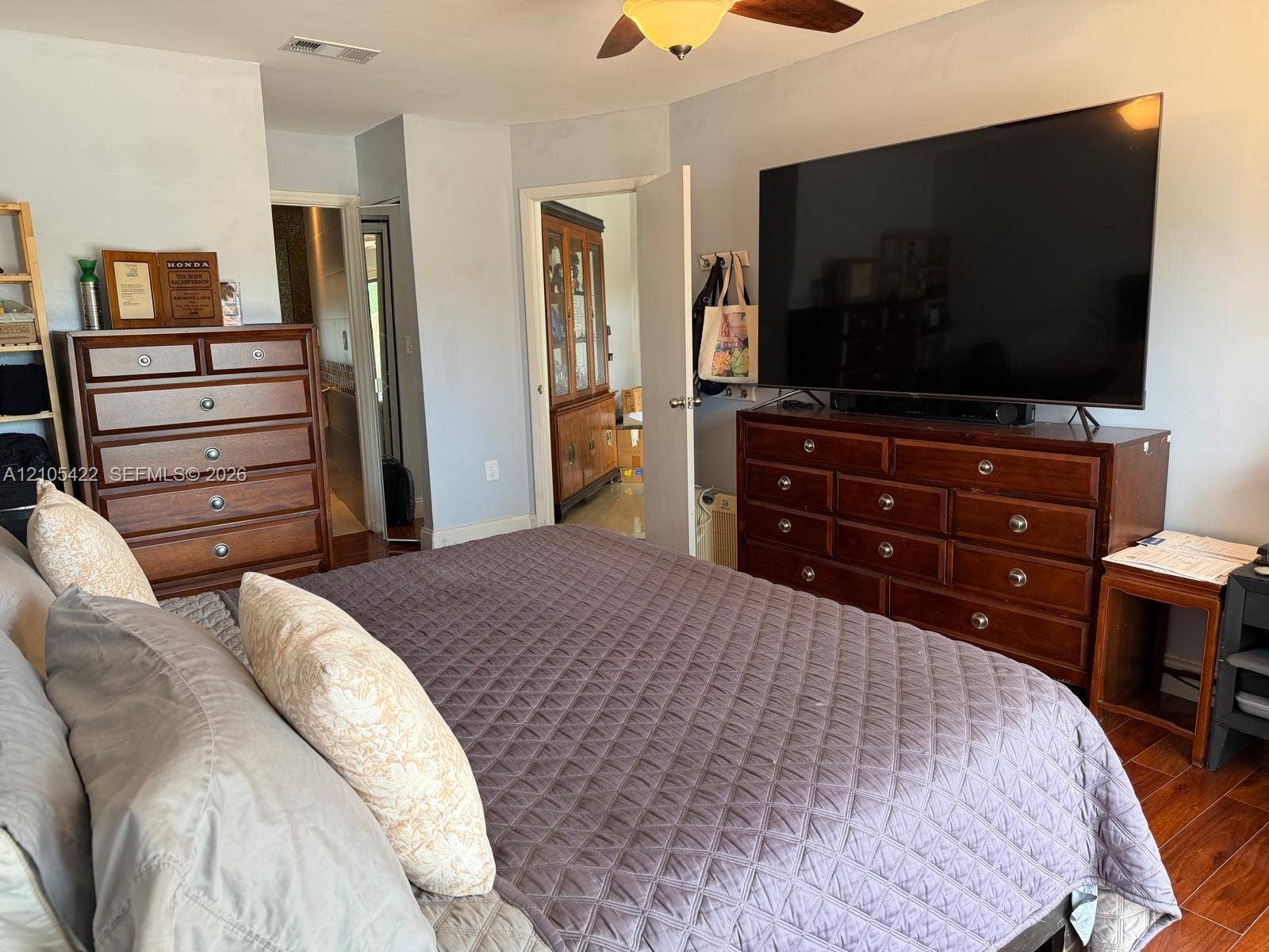 14631 SW 150th Street, Miami, FL 33186 Wood-finish flooring, ceiling fan with integrated lighting, and neutral wall tones