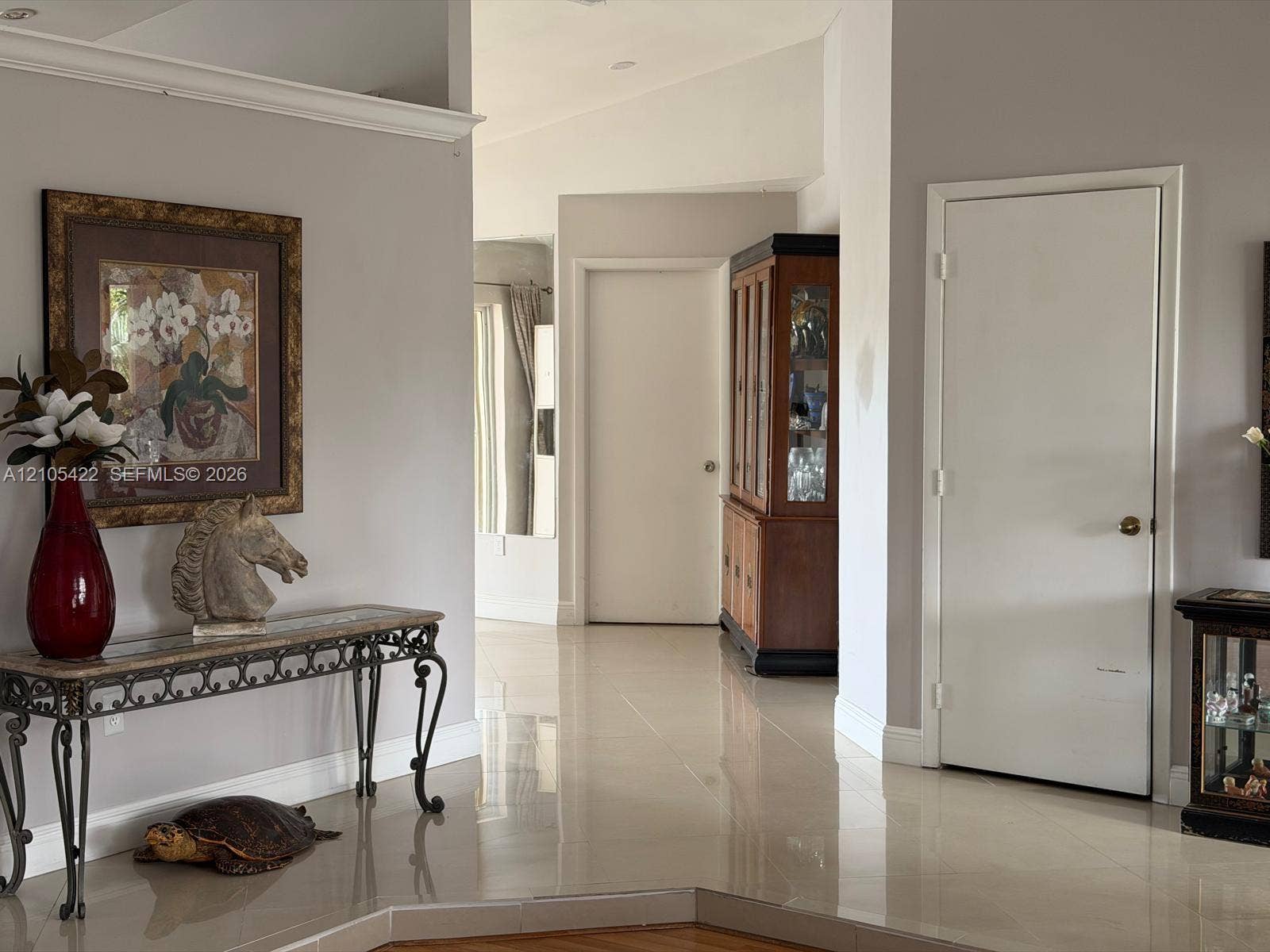 14631 SW 150th Street, Miami, FL 33186 Interior space featuring polished tile flooring, neutral wall tones, recessed lighting, and crisp crown molding