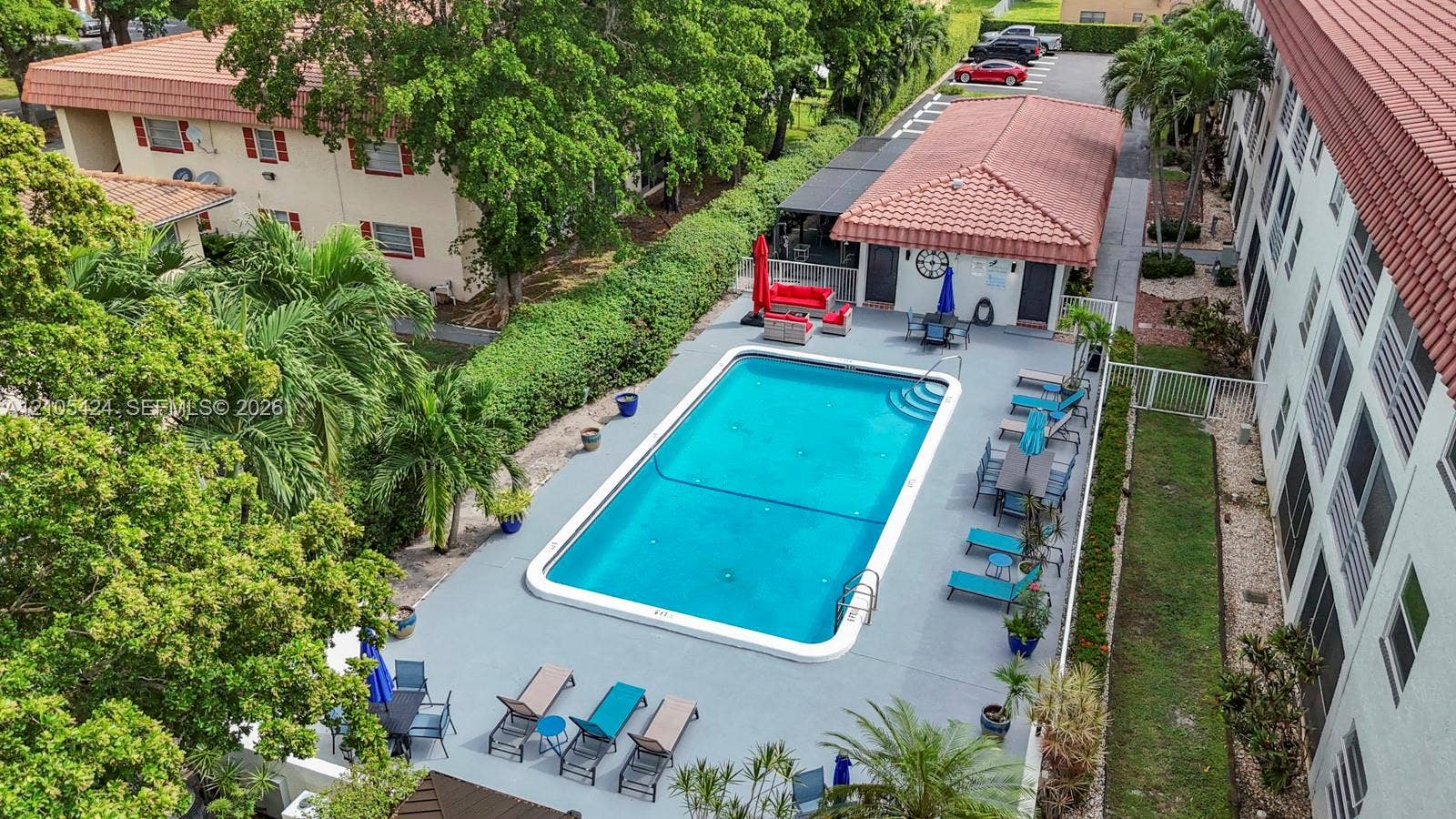 Rectangular swimming pool with a surrounding paved deck