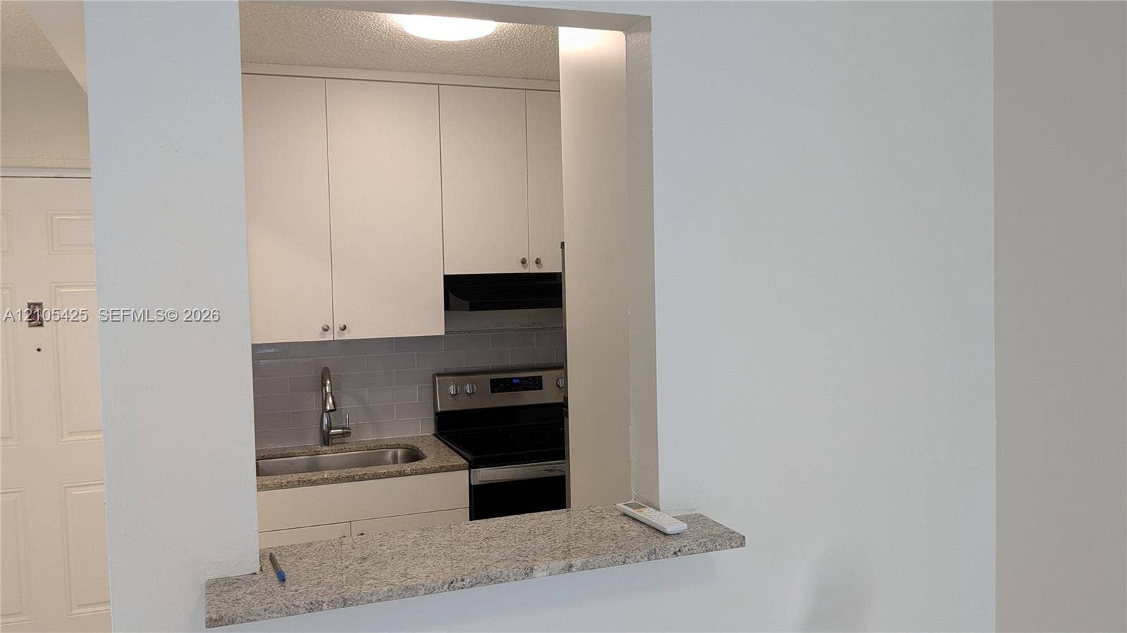 Kitchen pass-through with granite countertop