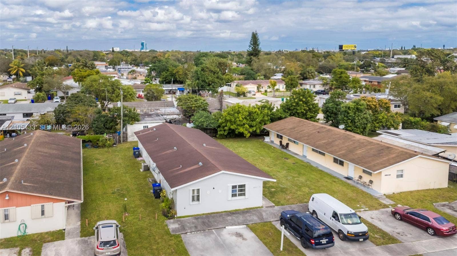 6331 Pierce Street, #1, Hollywood, Hollywood, FL 33024 Multiple residential buildings with light-toned exteriors and sloped roofs