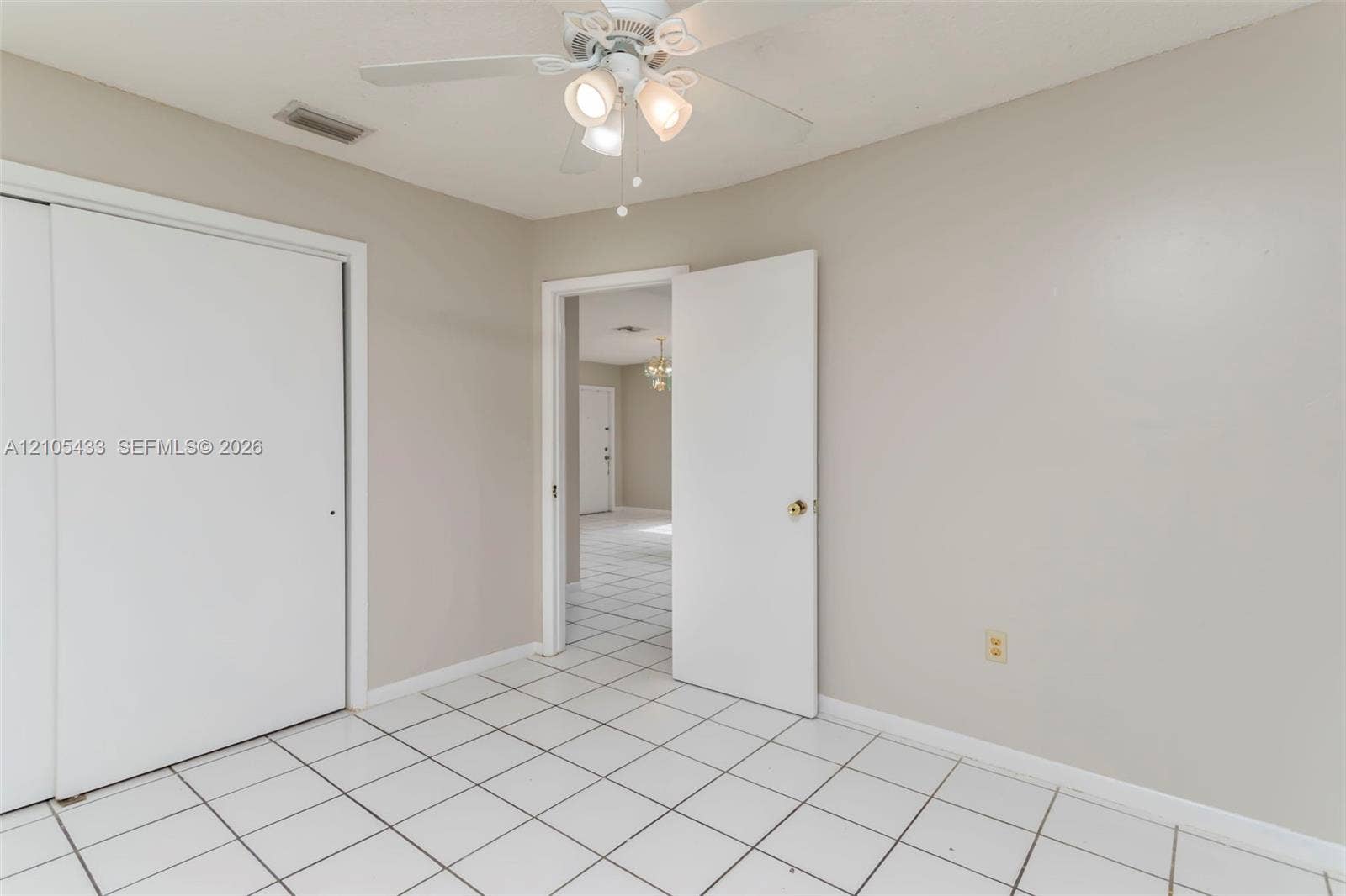 6331 Pierce Street, #1, Hollywood, Hollywood, FL 33024 White tile flooring, integrated ceiling fan with lighting, and a double-door closet